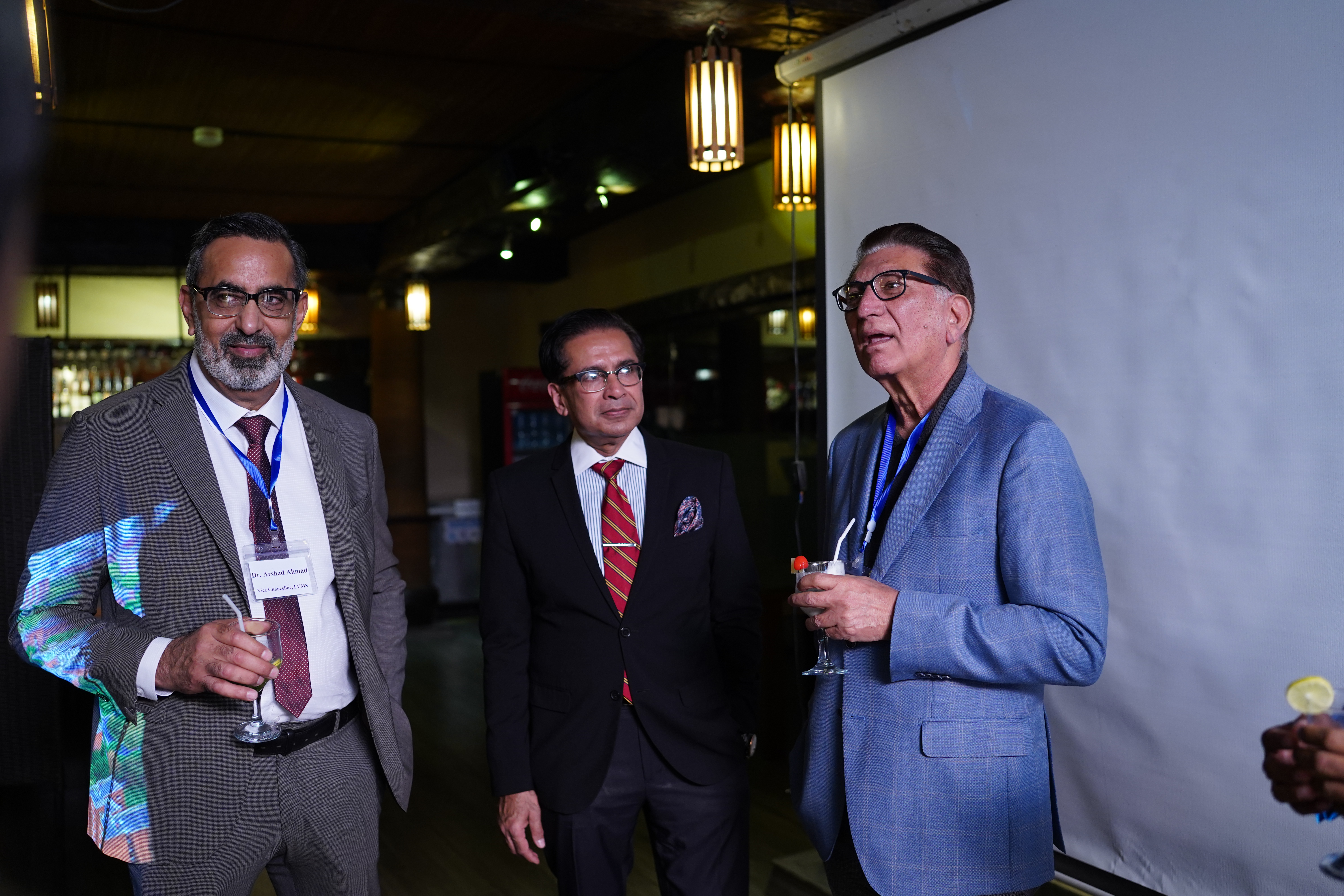 Awardees networking with Vice Chancellor, Dr. Arshad Ahmad over welcome drinks