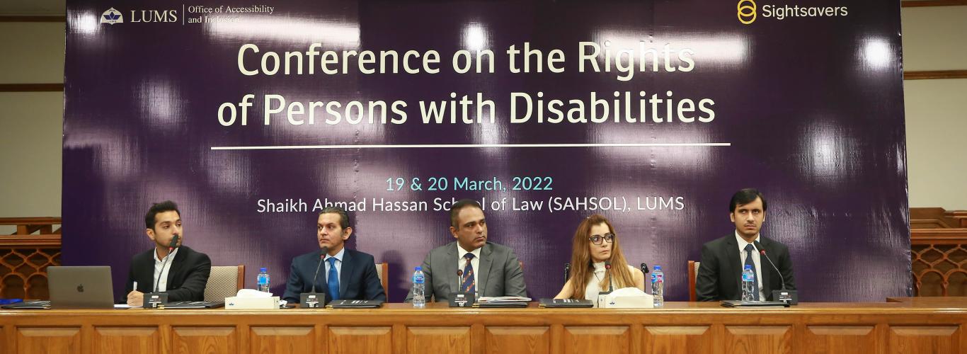 participants sitting on the stage for a session