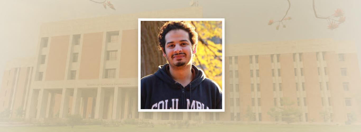 Image of Usama wearing a black hoodie with the SBASSE building in the background 