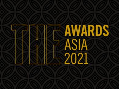 THE Awards Asia 2021 written in yellow on a black patterned background
