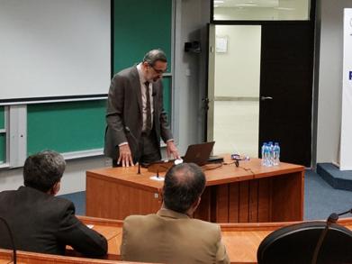 A glimpse of the classroom and Dr. Arshad speaking 